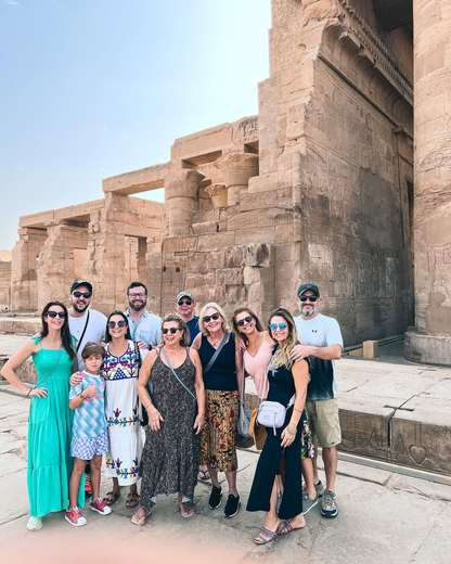 Tour group photographed together at the Temple of Kom Ombo on the Nile, Egypt